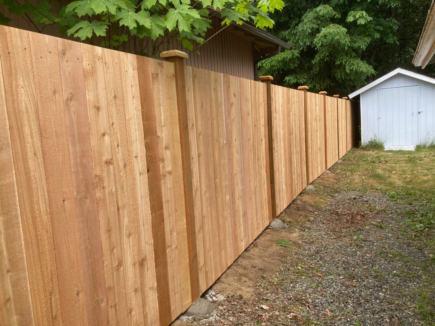 Cedar wood estate style fence on property line