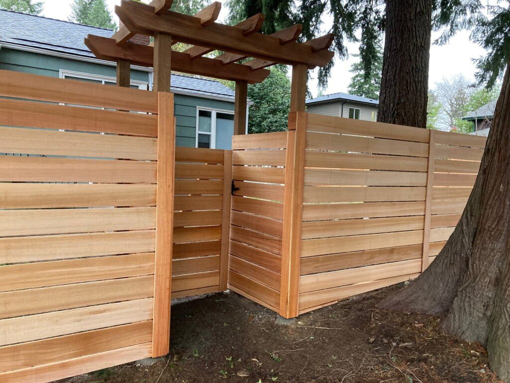 Horizontal wood fence with gate and trellis